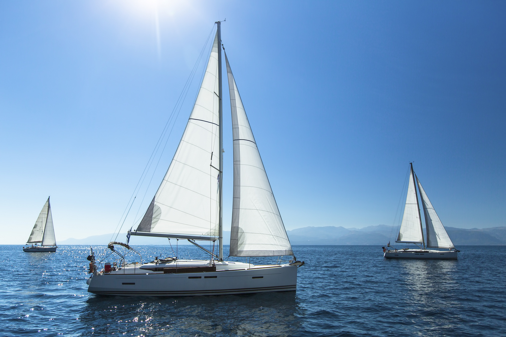 Sailing regatta. Sailing in the wind through the waves. Luxury yachts.