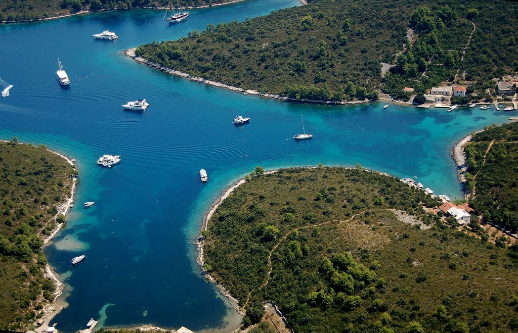 Aerial view of Scedro island anchoring spot with several boats anchored