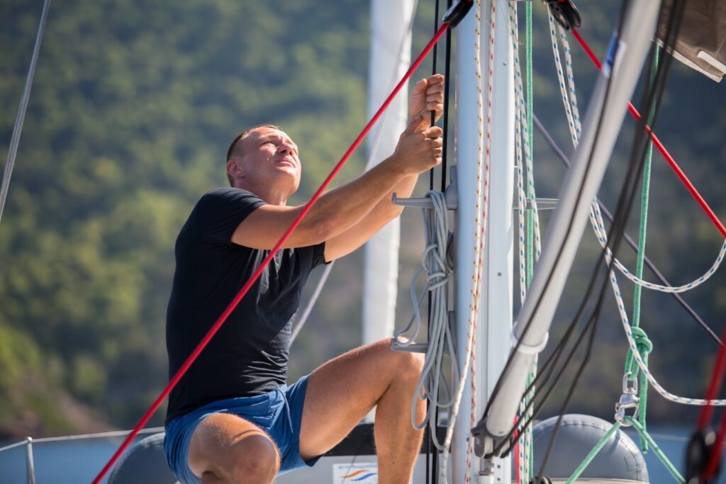 skipper-sailing-yacht-boat-ropes-man-sea