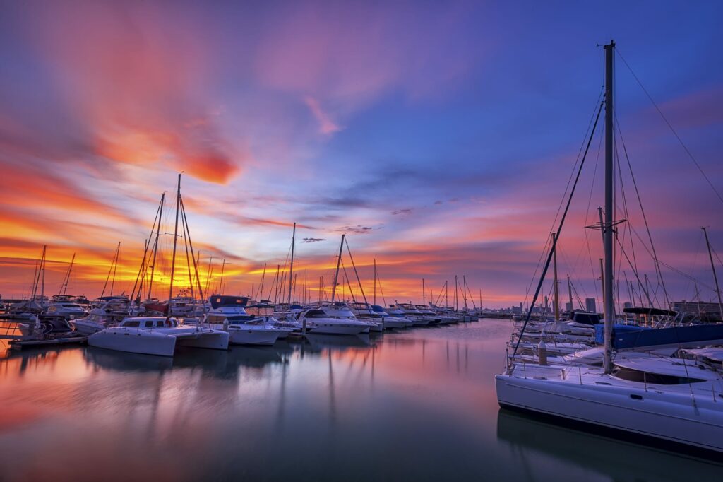 A boat marina in the sunset