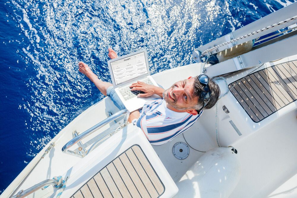 Men using ChatGPT onboard a sailing yacht